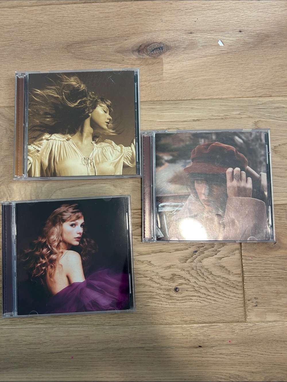 Taylor Swift cds Speak Now, Red, and Fearless (Taylor’s Version)
